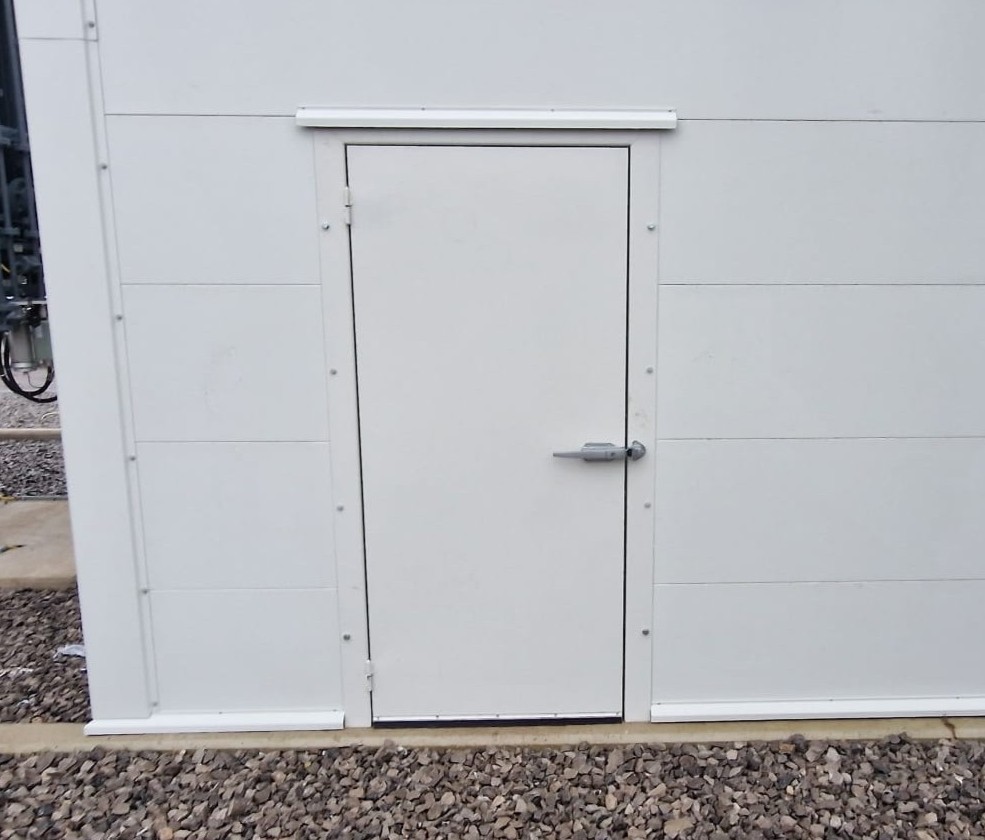Industrial noise proof door with slam lock