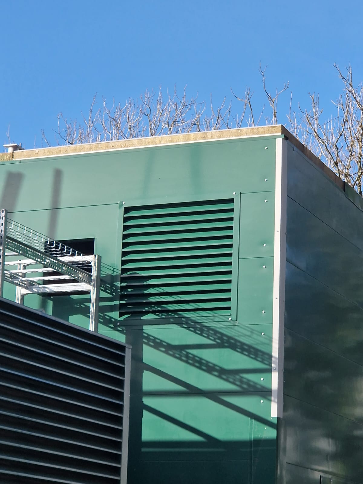 Attenuator for acoustic enclosure